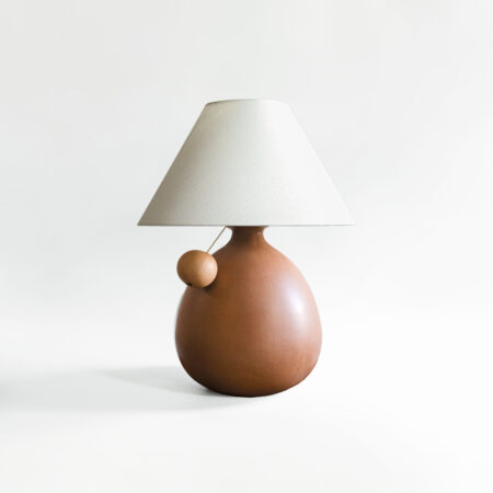Barro Terra table lamp with white linen shade.