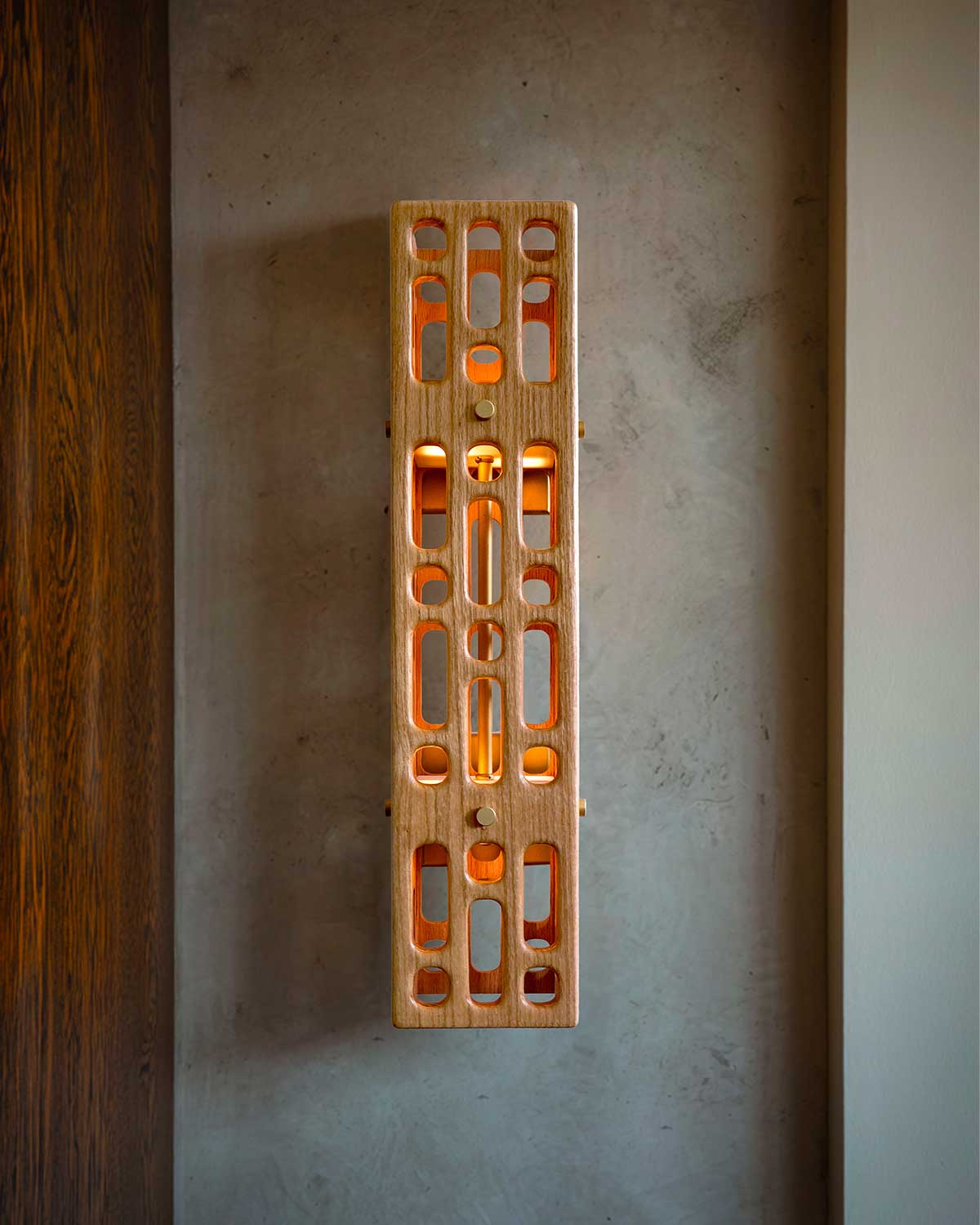 Celosia Sconce lit in hallway